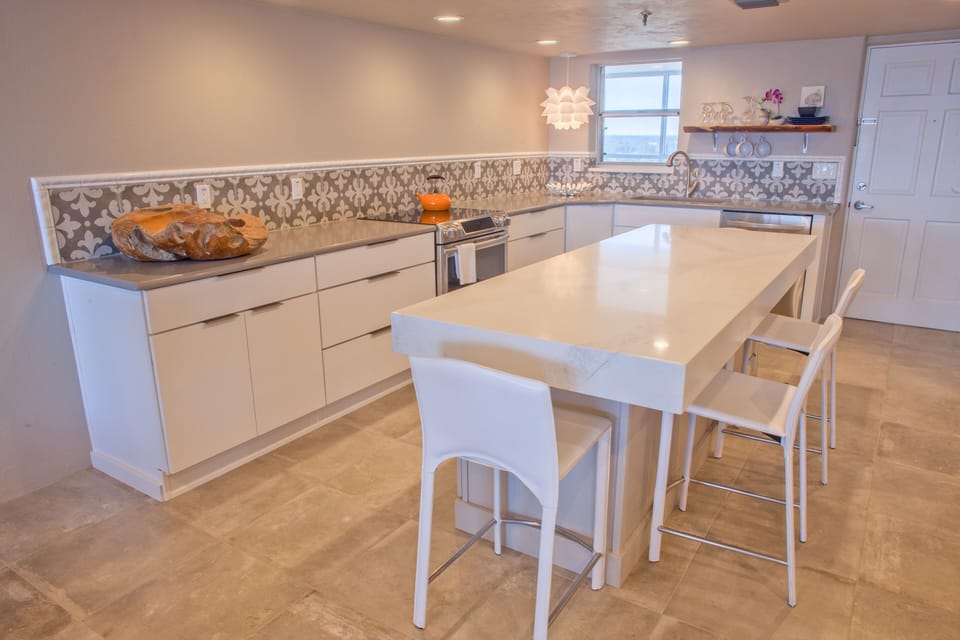 Encaustic tiles surround a luxe gourmet kitchen incl. a NINJA & electric juicer