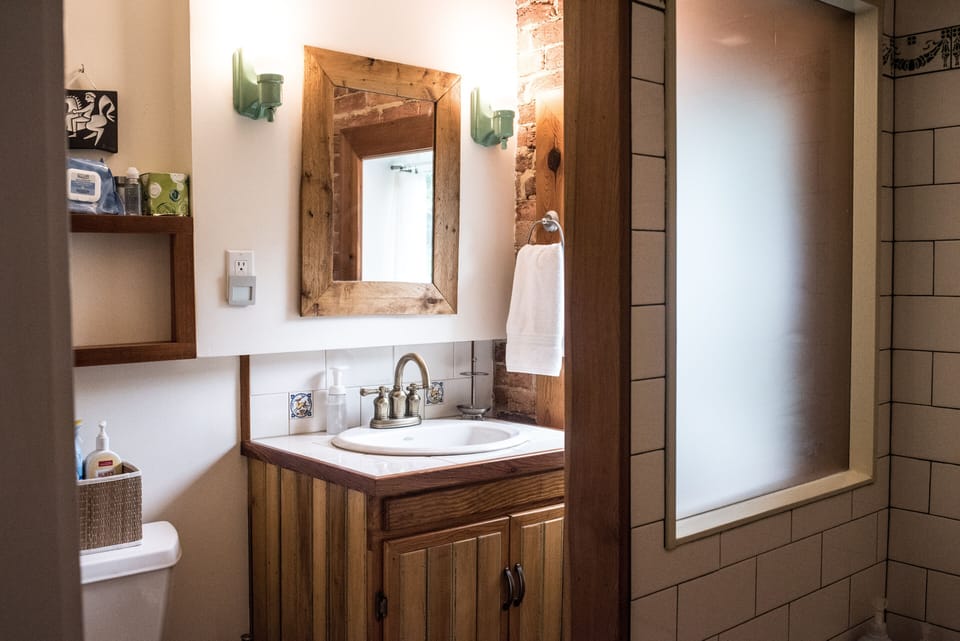 Master bath with custom vanity and soaking tub.