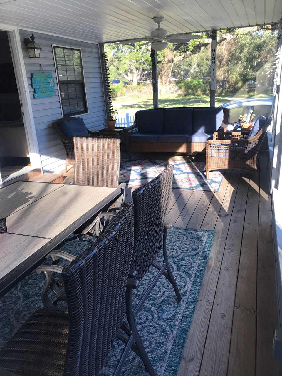 Screened porch with seating and dining
