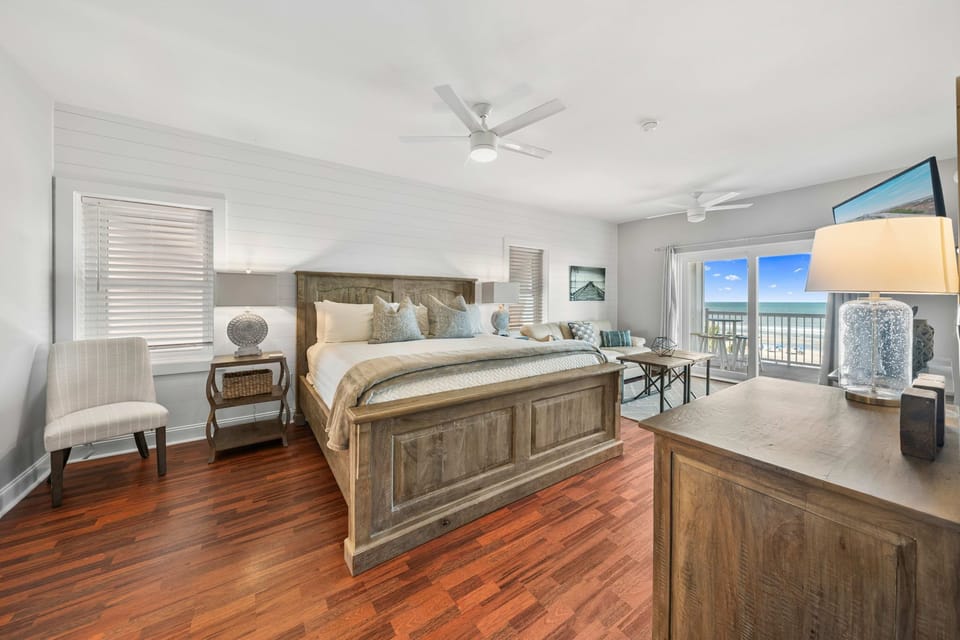 Bedroom 1: Primary King Suite  | Morning Sunrise | 302 Oceanview | 1116 Ocean Blvd, Isle of Palms, SC | IOP Escapes
