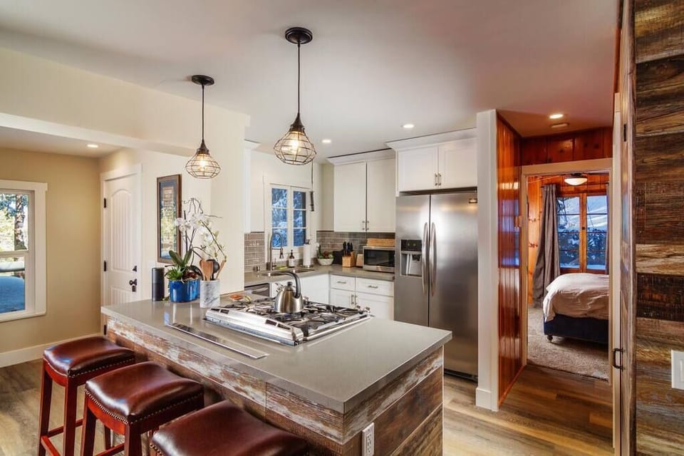 Main Level | Kitchen- Stunning collaboration of stainless, stone & hardwood