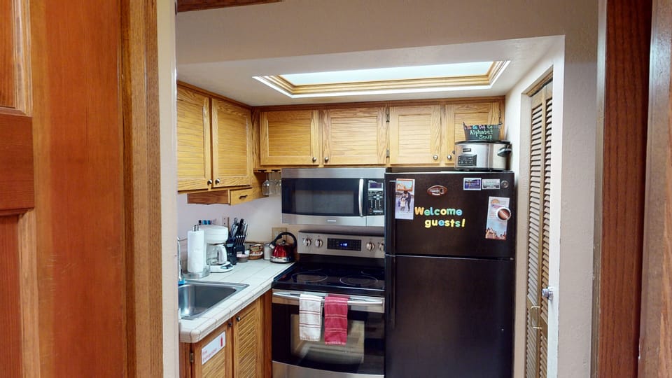 Full Kitchen with Full Size Refrigerator, Glass Stove Top, Oven & Microwave