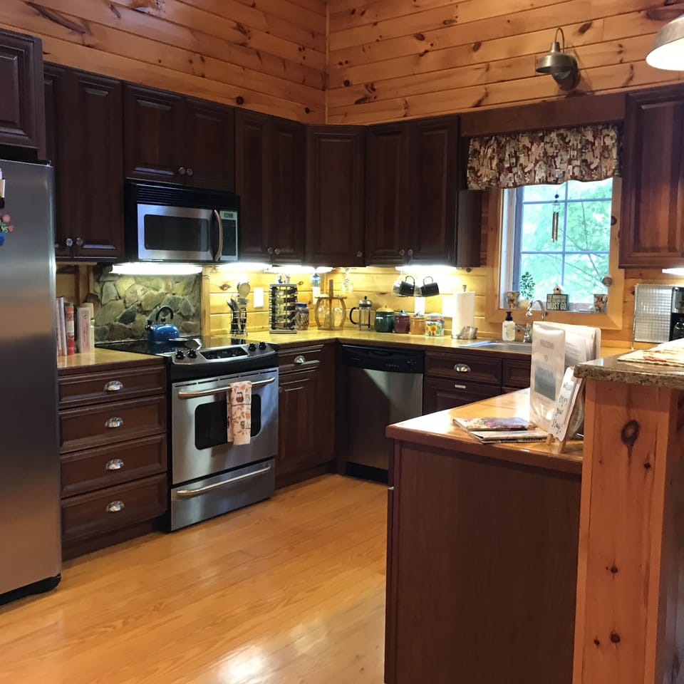 Kitchen with all stainless steel appliances and fully stocked