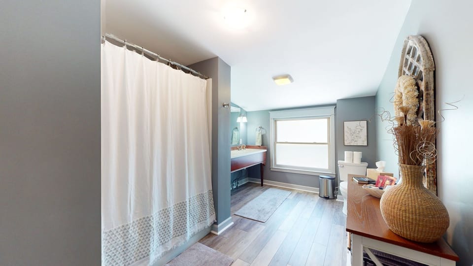 Upstairs full bathroom is accessible from hallway
