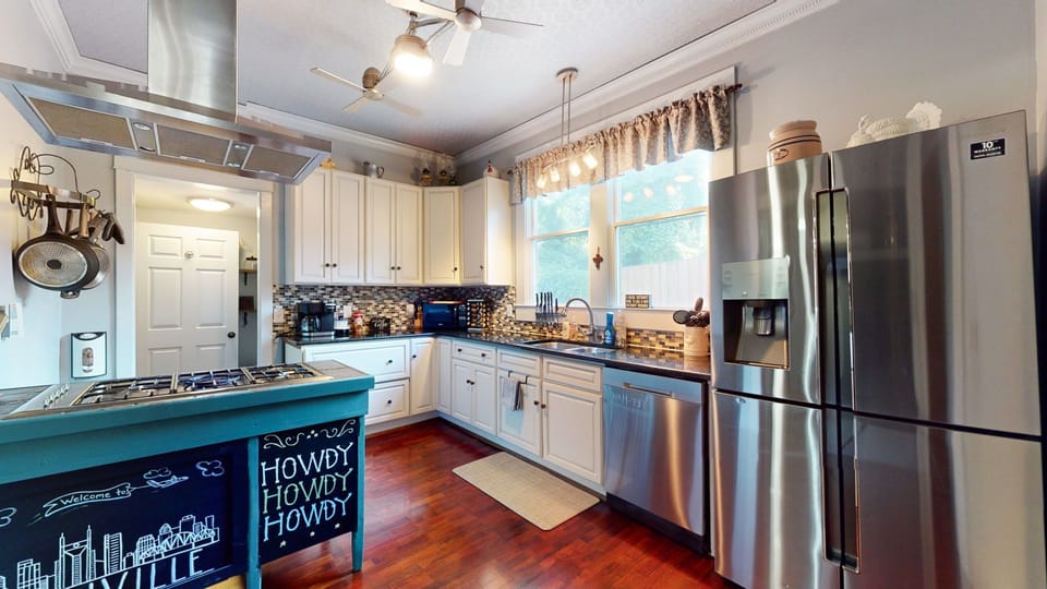 Spacious kitchen with gas stove, double oven, and stainless refrig w/ ice maker.
