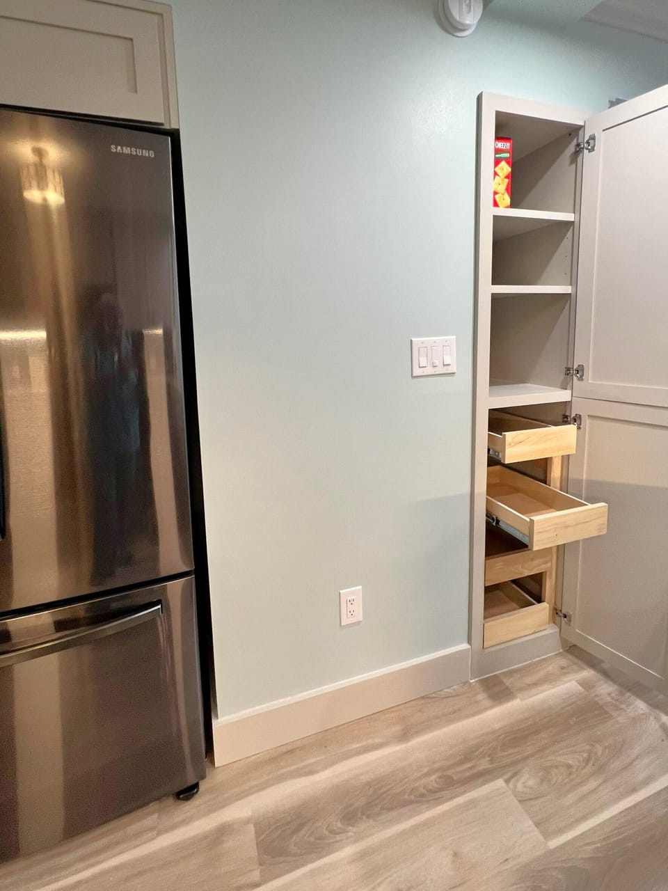 Storage pantry with pull out shelves 
