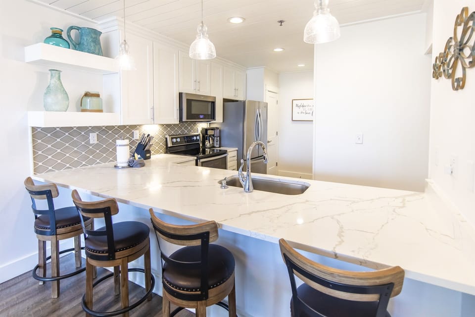 Kitchen with island and bar stools