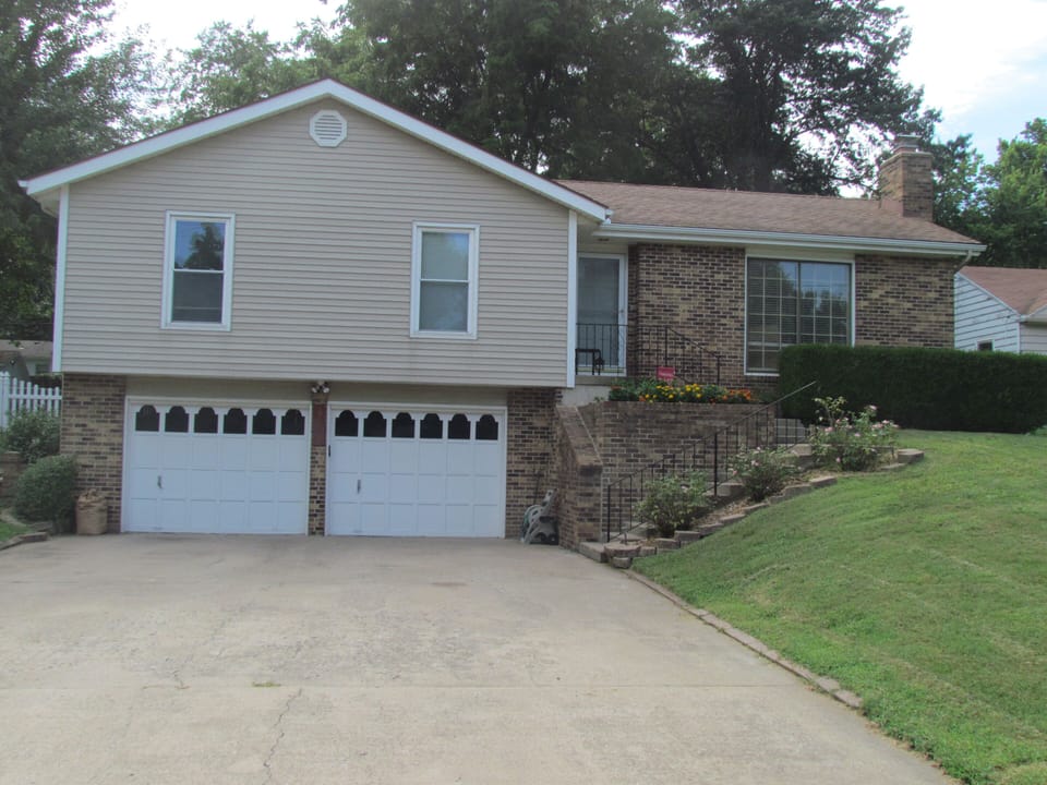 Front of our three bedroom raised ranch with double car garage