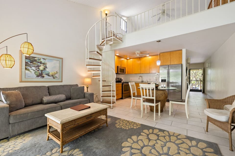 Airy living space w/ open stairs & comfy seating for effortless hangouts.