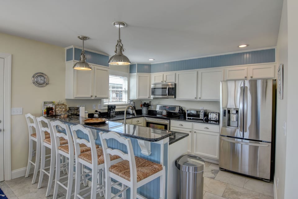 All the bells and whistles in the modern granite counter top kitchen