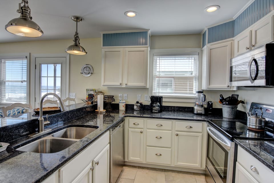 Well stocked kitchen with every appliance you enjoy at home and them some?