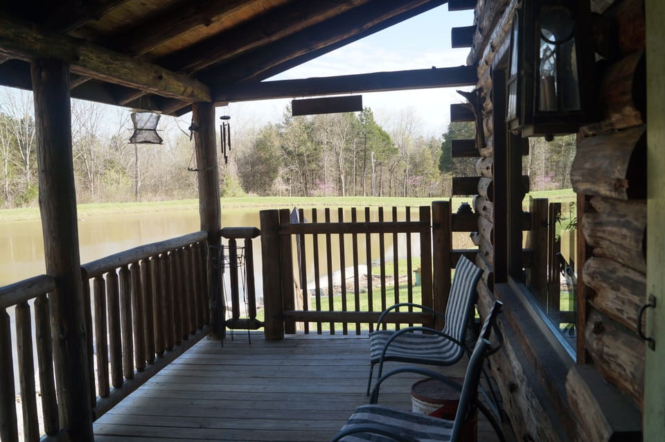 Front porch where you will enjoy feeding the catfish and watching aquatic life.