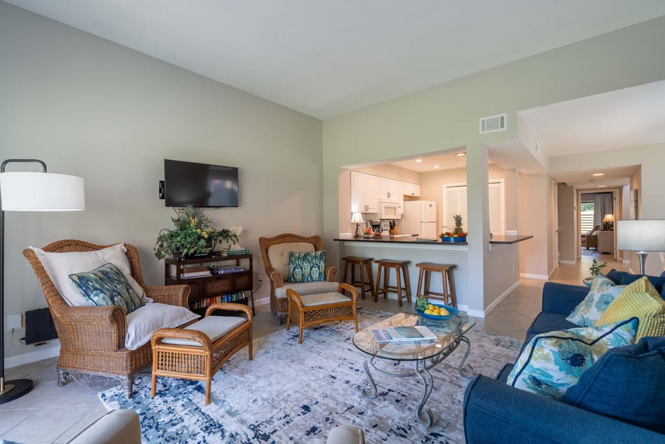 Open floor plan includes bar stools for extra dining space.