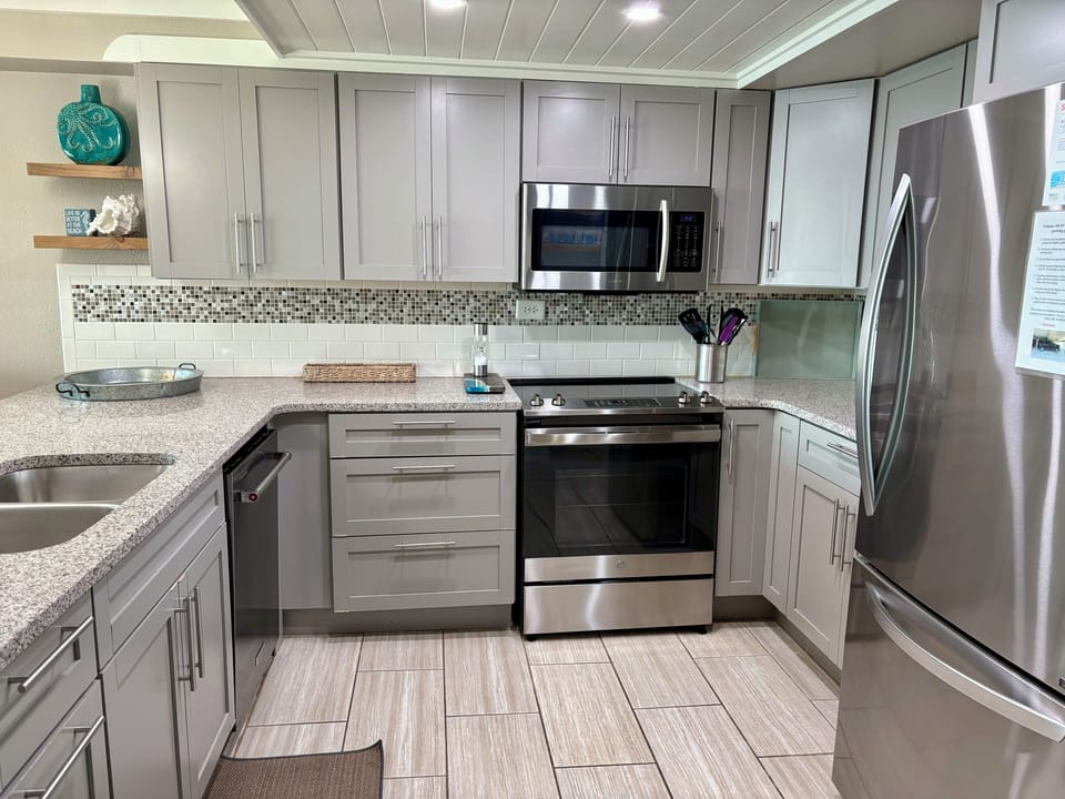 Kitchen with quartz countertops and stainless steel appliances