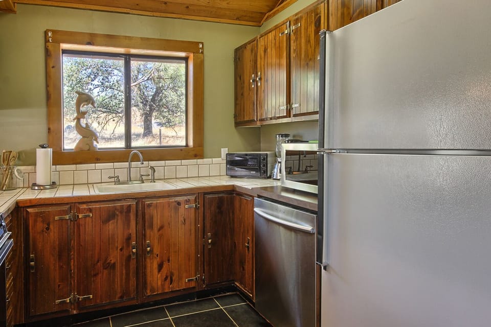 kitchen featuring a quiet dishwasher and a refrigerator. 