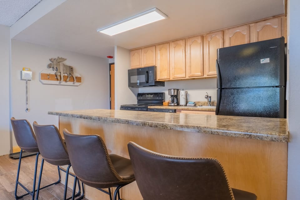 Kitchen includes full sized appliances and all the dishes and cookware needed for meals