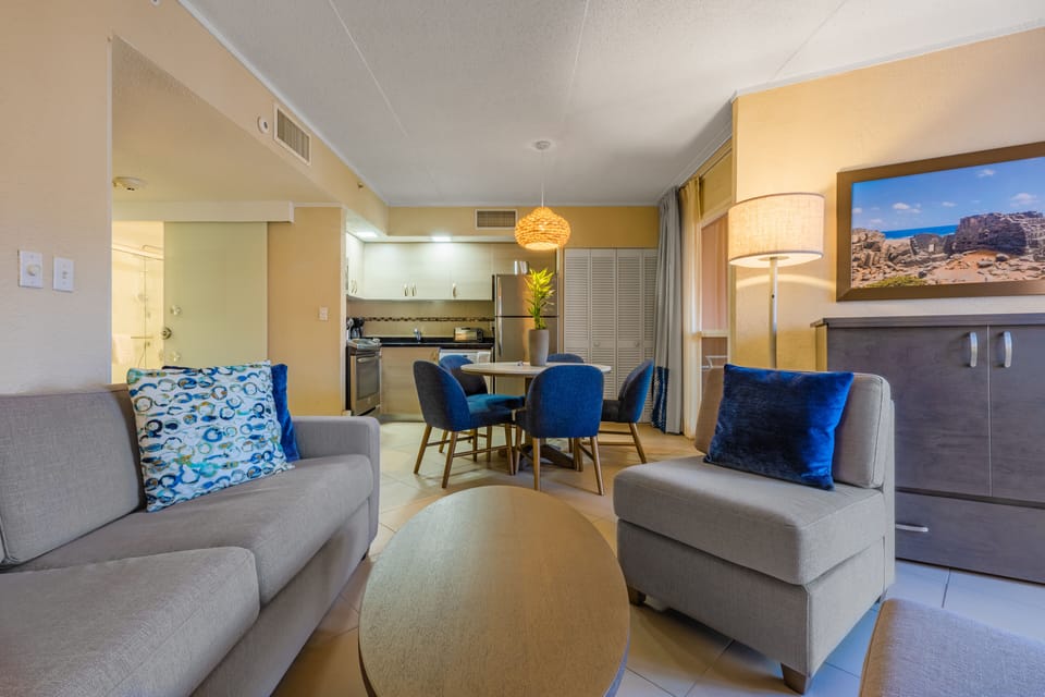 Suite, 1 Bedroom | Living room | 24-inch plasma TV with cable channels, TV