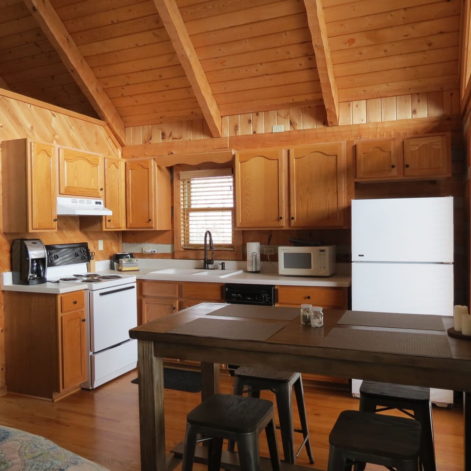 Full Kitchen with ample supplies for dining/cooking