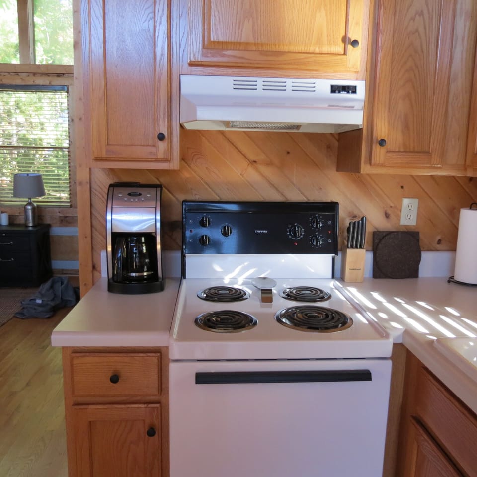 Four burner stove with oven and plenty of cabinet storage for your supplies.