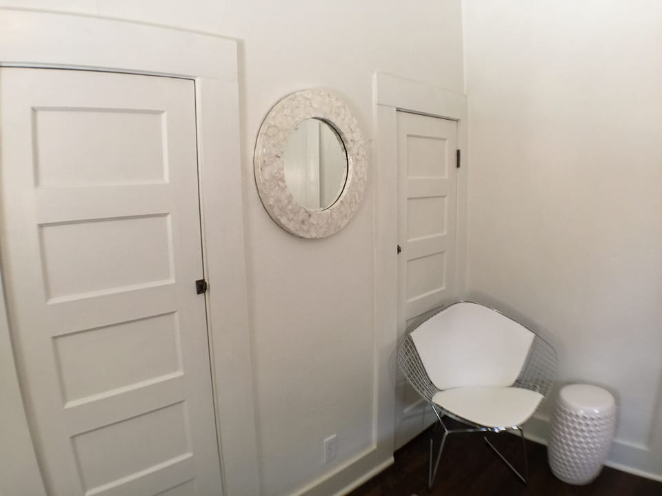 Dual closets in the King bedroom wwith a soothing monochromatic palette.