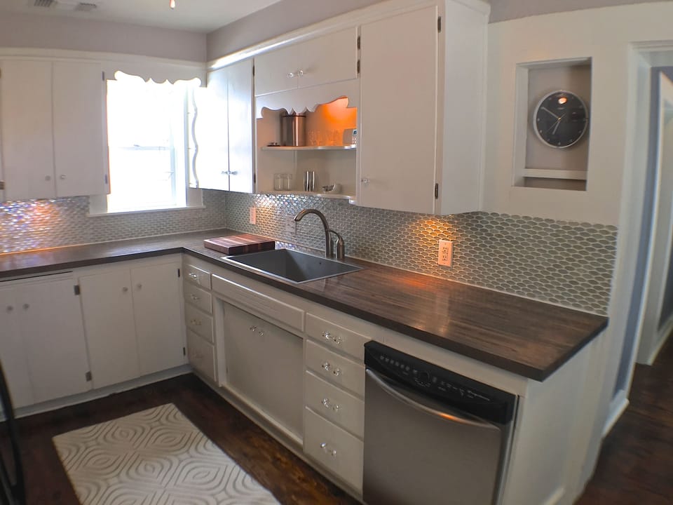 The kitchen cabinets are from the 40's, but everything else is modern.
