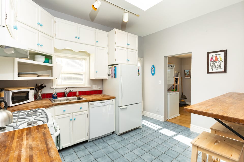 Fridge and Door leading to Side Patio and 3rd Bedroom/Flex Room