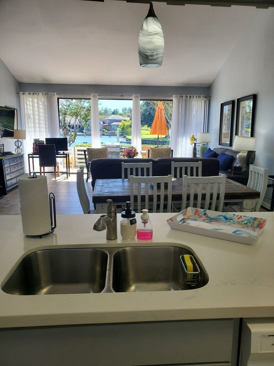 a view from kitchen sink out to the lake. 