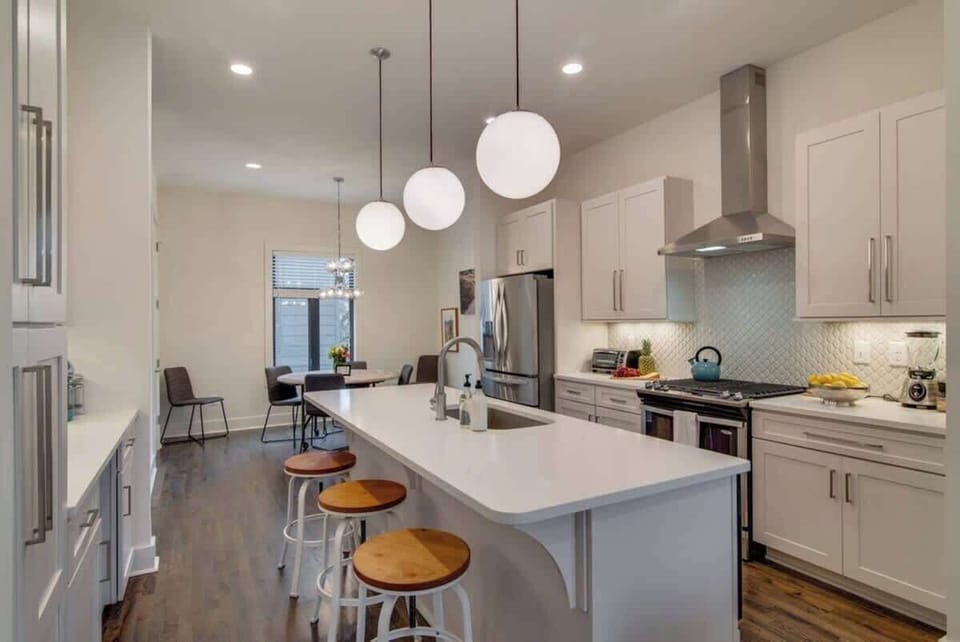 The kitchen island offers additional seating, making it a perfect spot for casual breakfasts or evening snacks.