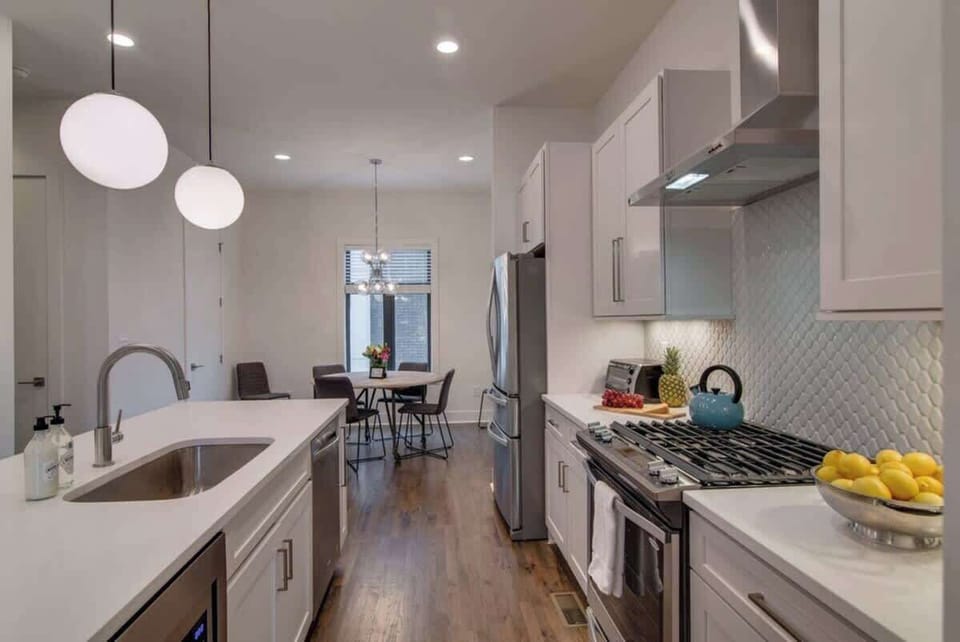 Bright, modern kitchen with stainless steel appliances, quartz countertops, and everything you need to cook and gather in style. Perfect for morning coffee or a shared meal before heading out to explore.