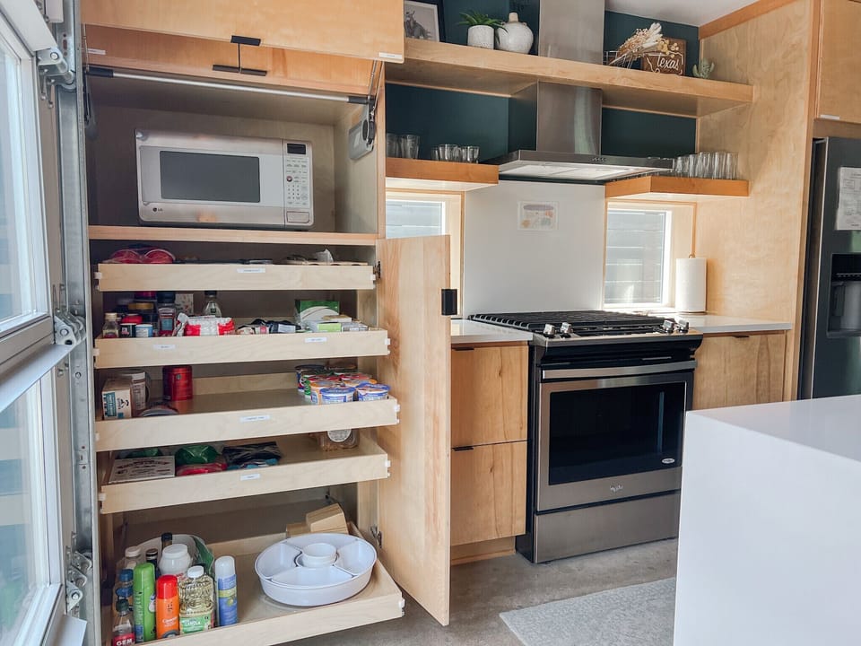 Complimentary spices, coffee, tea, snacks, and the microwave are all tucked away