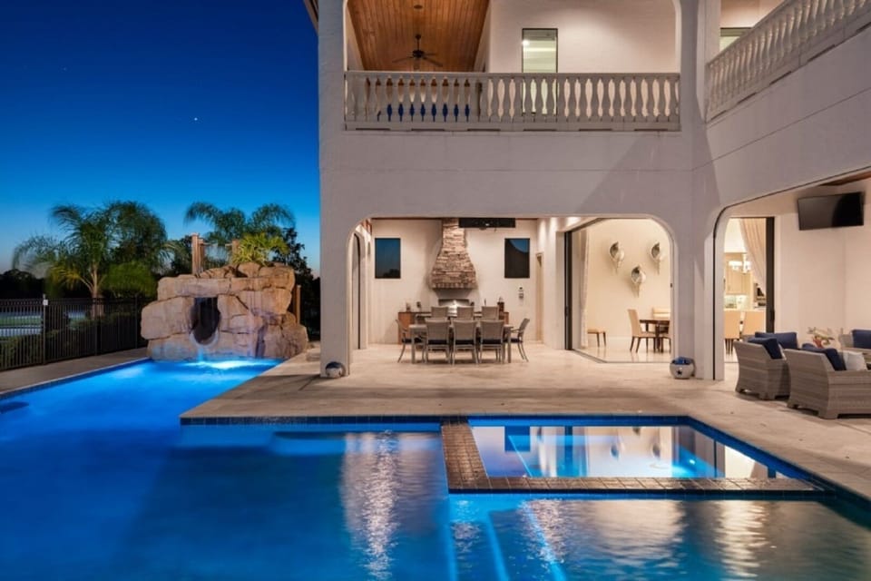 Immerse into a heated pool or the 10 person spa with a custom rock waterslide.