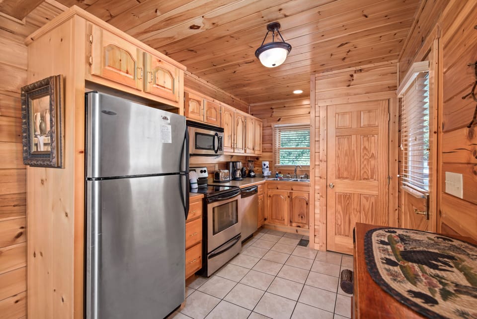Kitchen with stainless appliances and washer/dryer