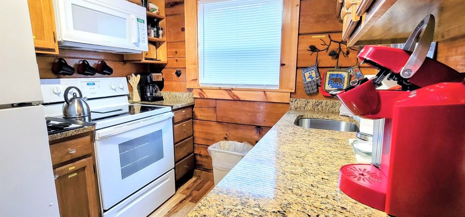 Galley kitchen - glass top stove, microwave, refrigerator, full size Keurig 