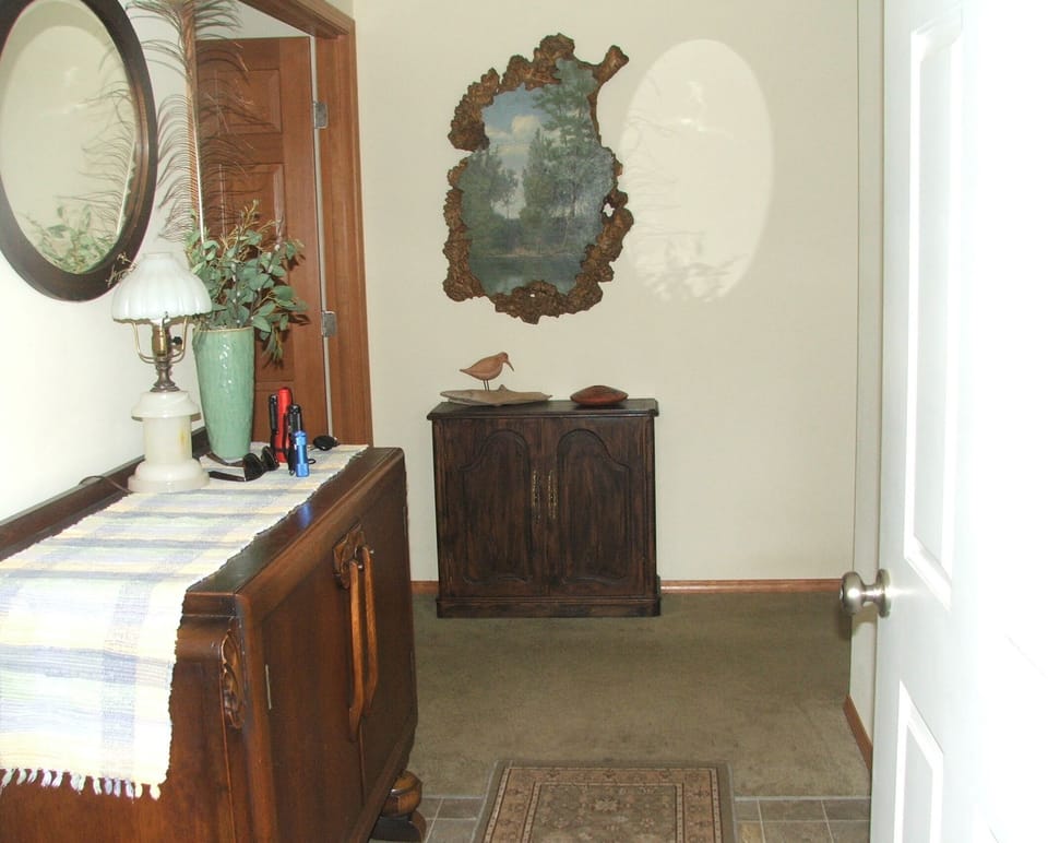 Entry way, showing double doors to master bedroom on the left