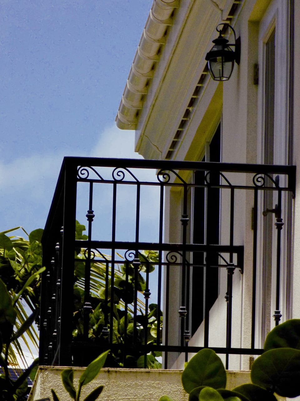 Private balcony overlooking the Caribbean Sea. Contact us and book now.