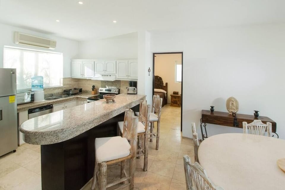 Granite countertop and high bar chairs 