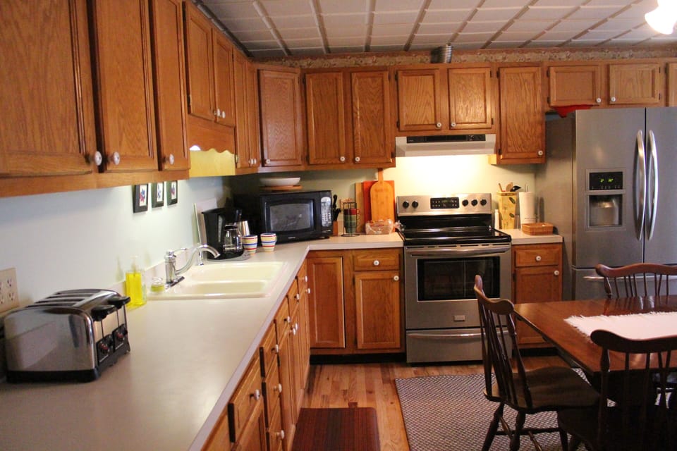 Modern kitchen with brand new red oak flooring, plenty of counter space