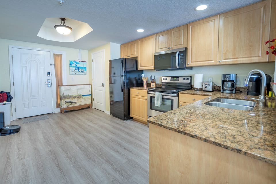 Entry & kitchen with new floor installed 2022