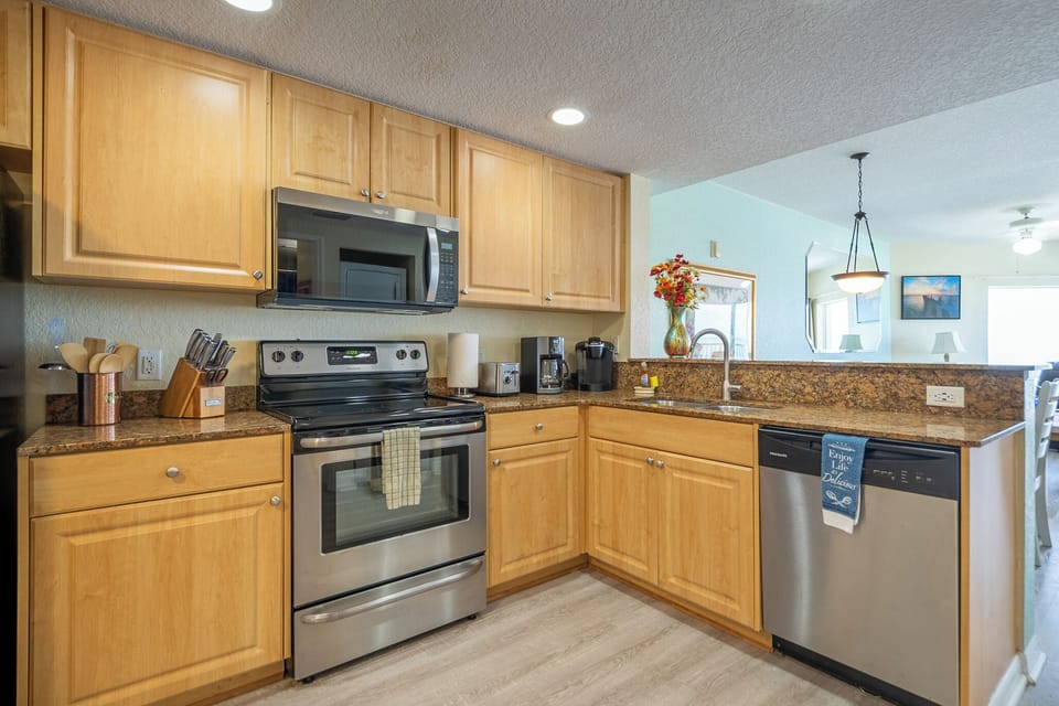Full kitchen: refrigerator, dishwasher, stove/oven, microwave, coffee makers. 
