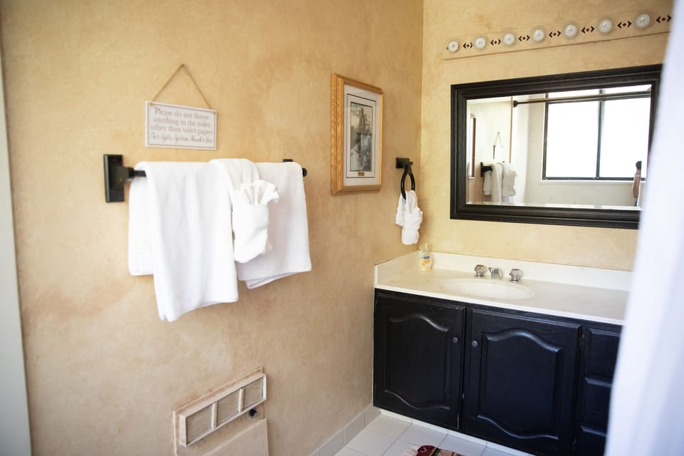 Main level full bathroom. Across the hall from the washer and dryer.