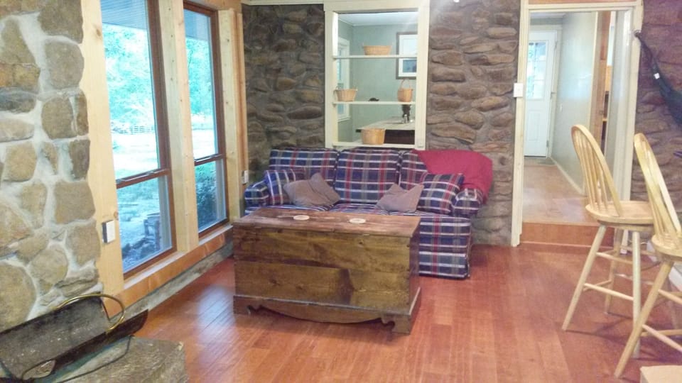 Great room has hardwoods and stone fireplace. Sofa pulls out to sleep 2.