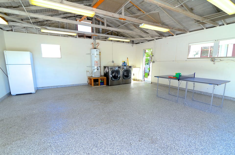 Large garage with oversized washer and dryer.  