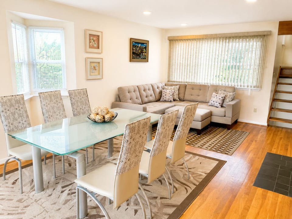 Spacious living room and dining area  with natural light and plenty of seating f