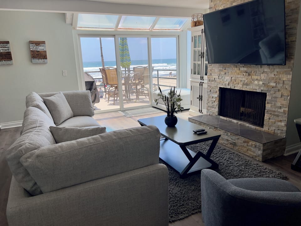 Our cozy family room with a fireplace and TV. 