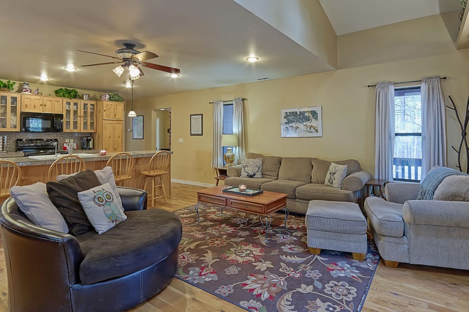 Awesome great room!  The brown chair spins to face the couch or the fireplace.