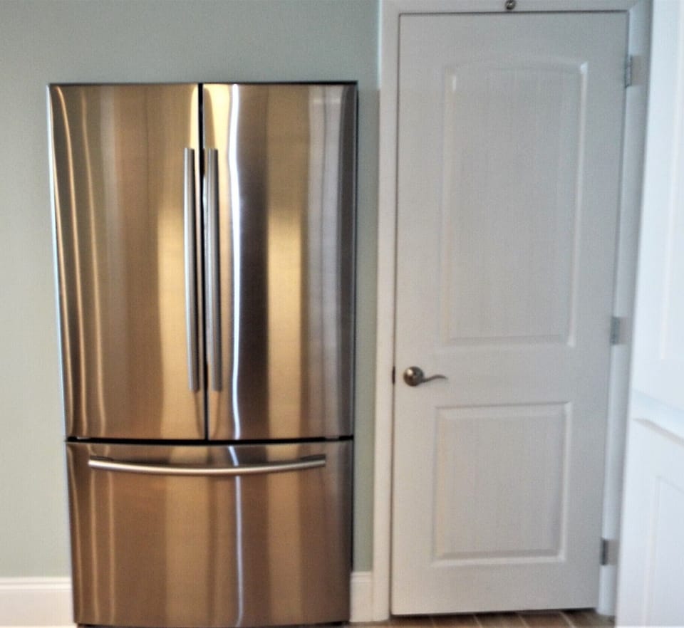 Pantry and fridge in kitchen area