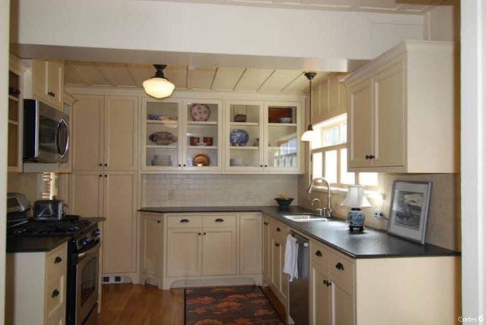 kitchen has stove, microwave, dish washer, and laundry room has washer and dryer