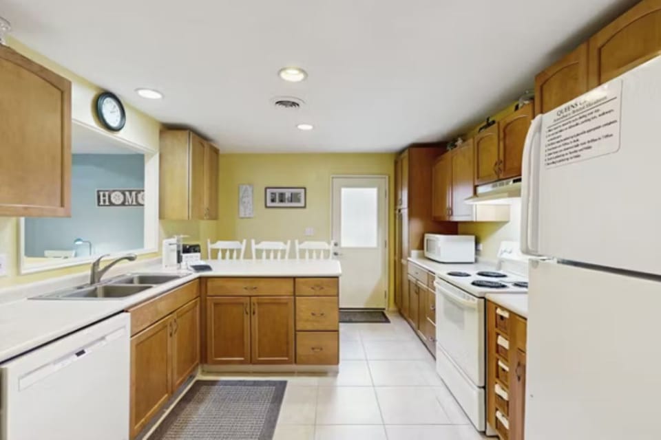 Fully stocked kitchen with breakfast bar is perfect for dining in!