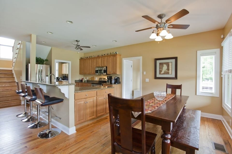 Dining table will seat 8-10 and the breakfast bar will seat 4.