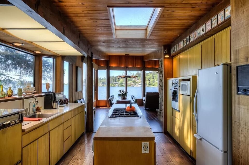 Double galley kitchen with windows and skylight
